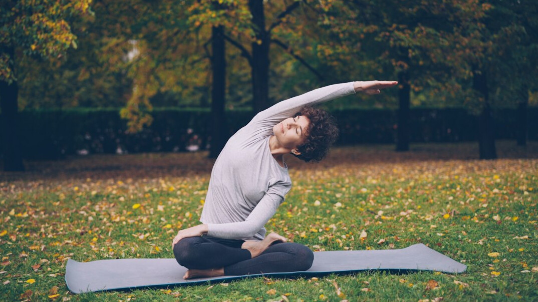 person meditating outdoors