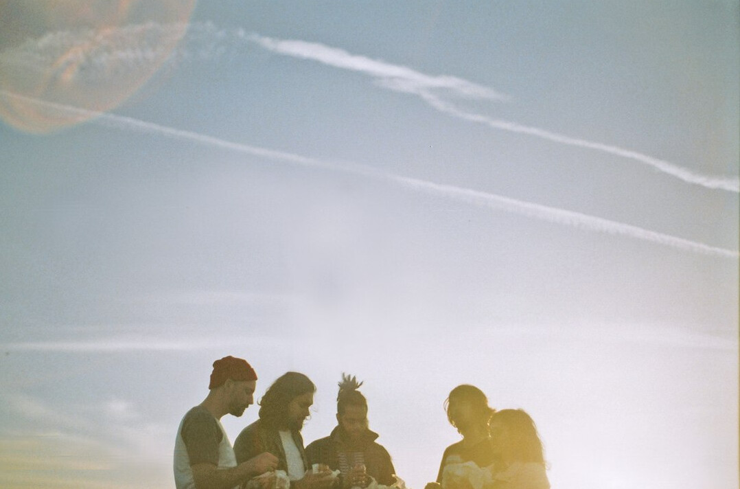 Small group of diverse Brazilian people sitting in a circle talking